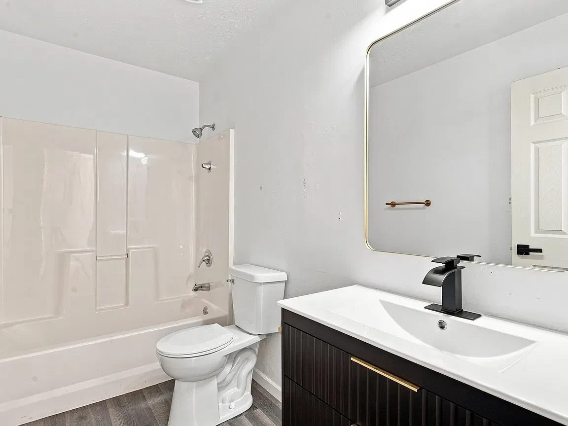Renovated bathroom with white fixtures
