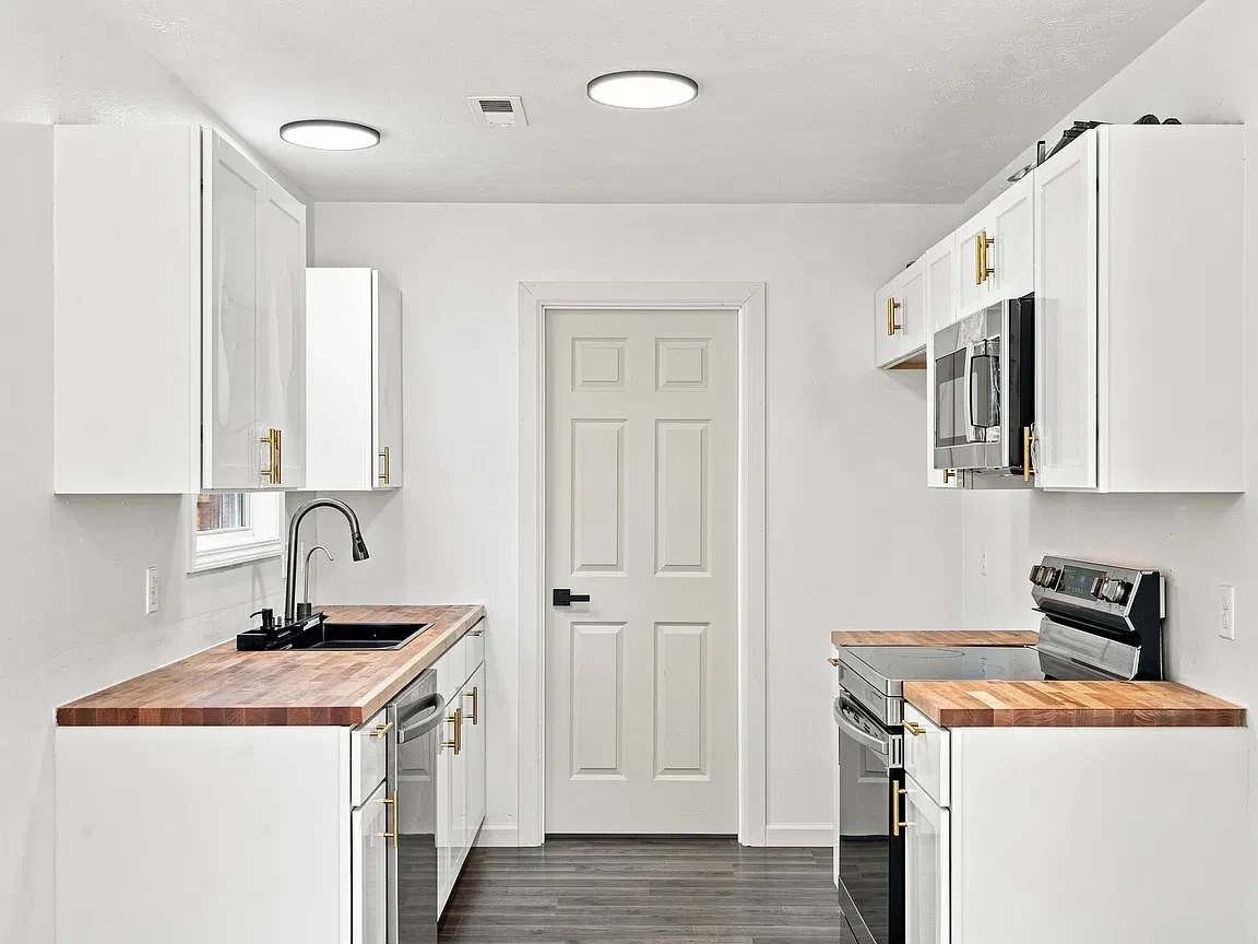 Bright renovated kitchen with white cabinets