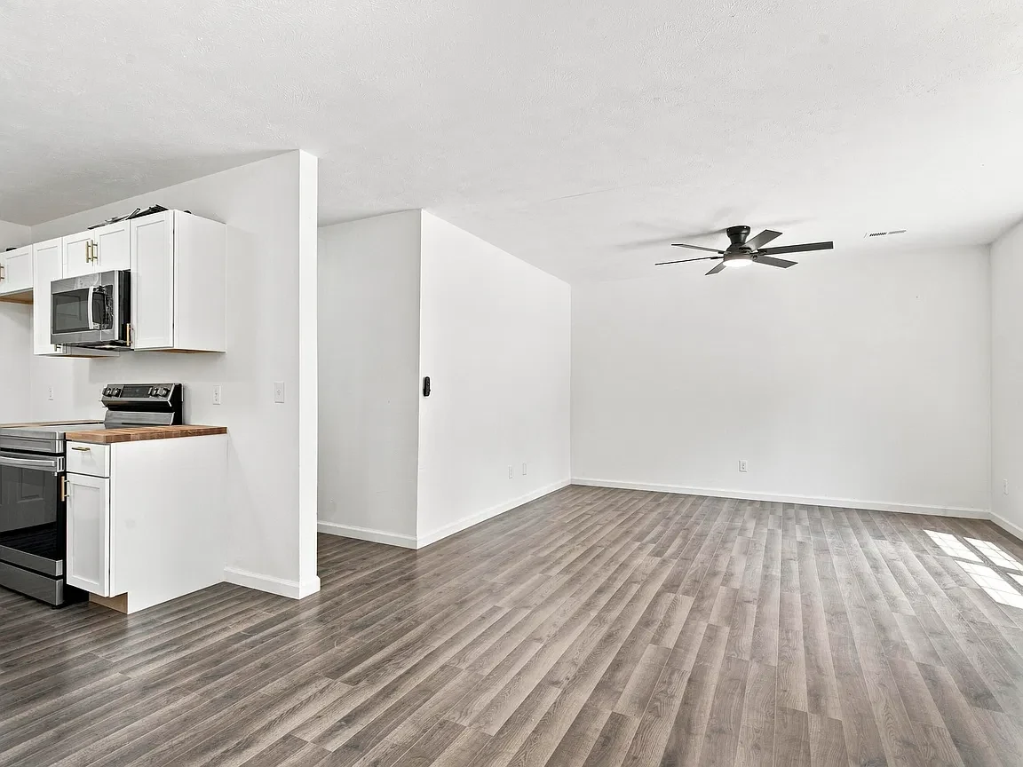 Renovated open living area with new flooring